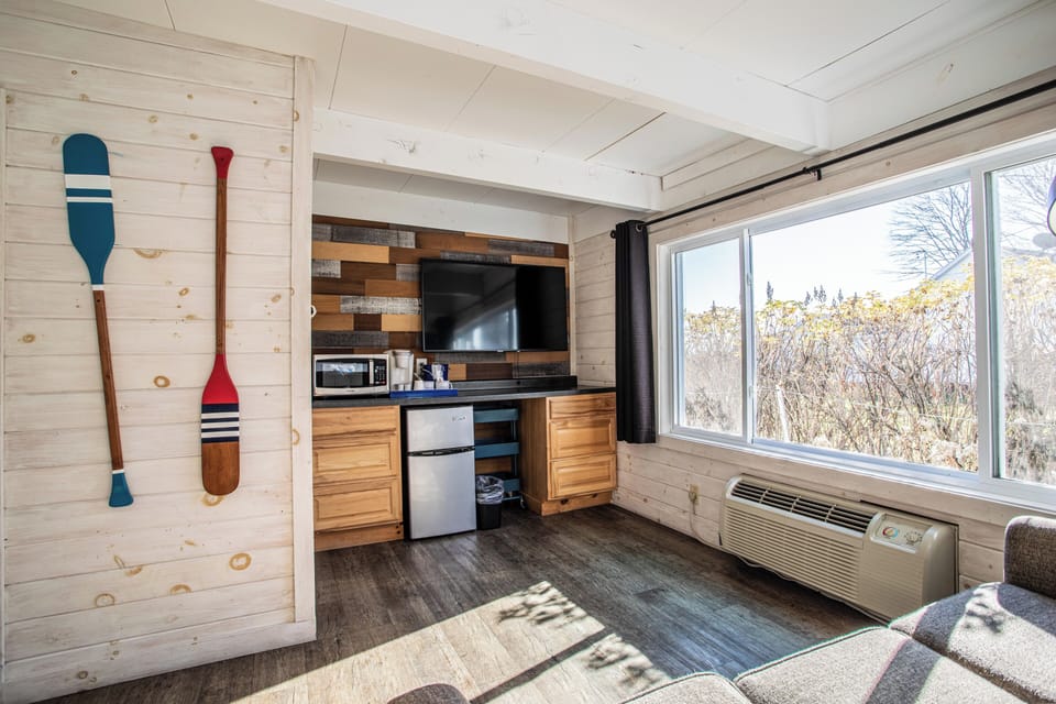 Family Room, Partial Lake View 114, Pet Friendly | Living area | 55-inch Smart TV with cable channels, TV