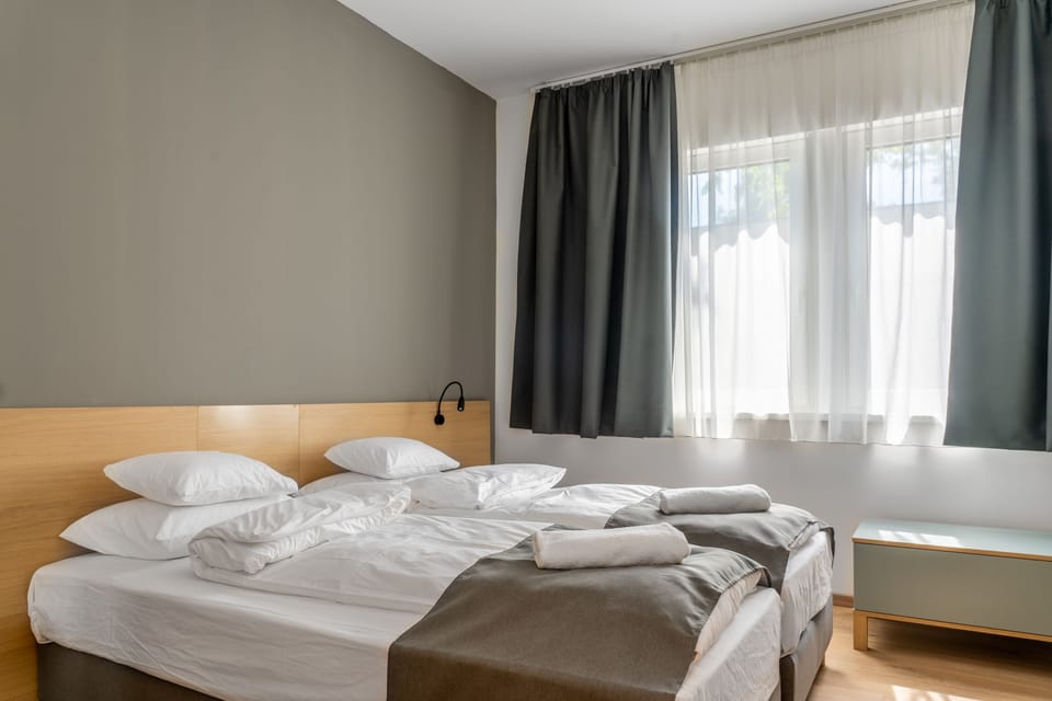 Standard Double or Twin Room | In-room safe, desk, laptop workspace, blackout drapes
