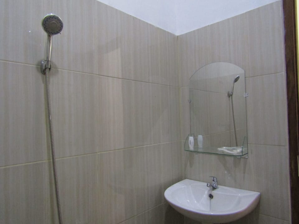 Standard Fan Room | Bathroom | Shower, free toiletries, slippers