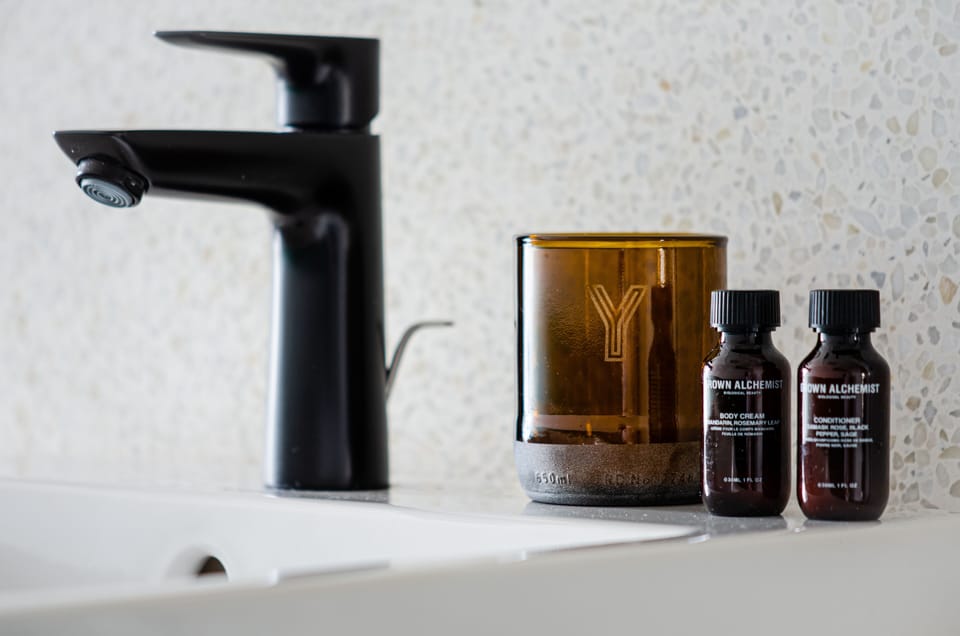 Shower, rainfall showerhead, hair dryer, towels