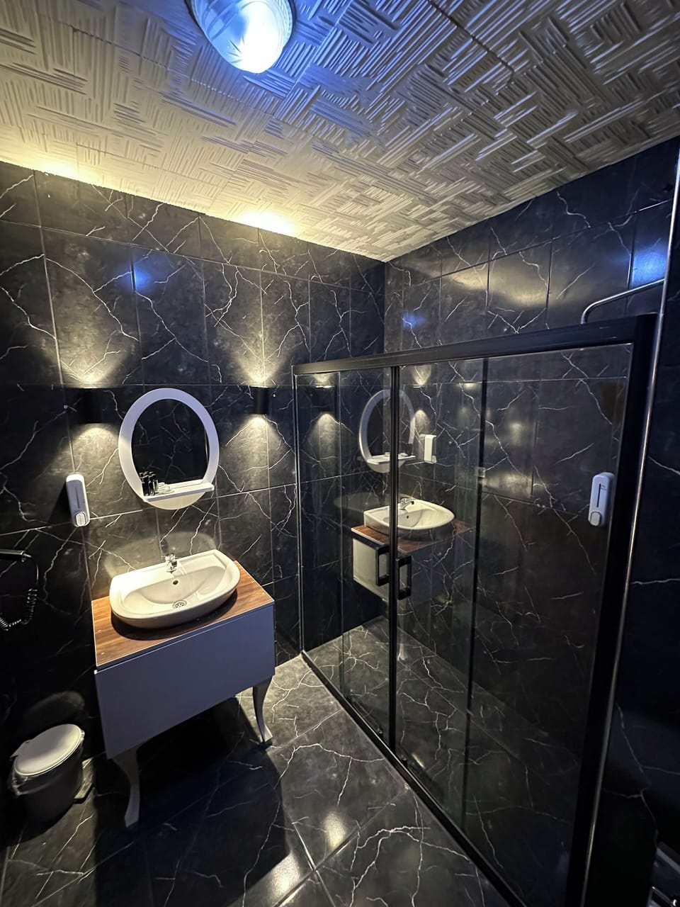 Deluxe Quadruple Room | Bathroom | Designer toiletries, hair dryer, slippers, towels