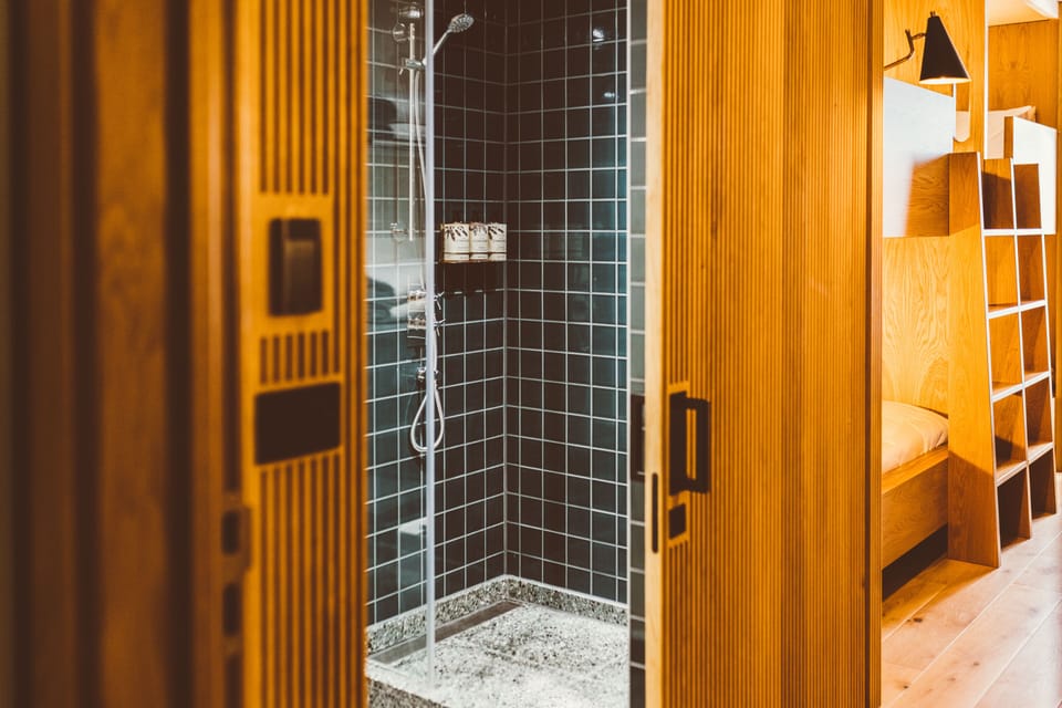 Shower, rainfall showerhead, hair dryer, towels