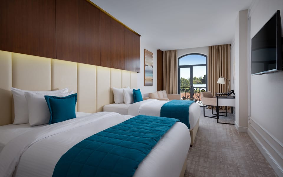 Deluxe Twin Room, 2 Queen Beds | In-room safe, desk, laptop workspace, blackout drapes