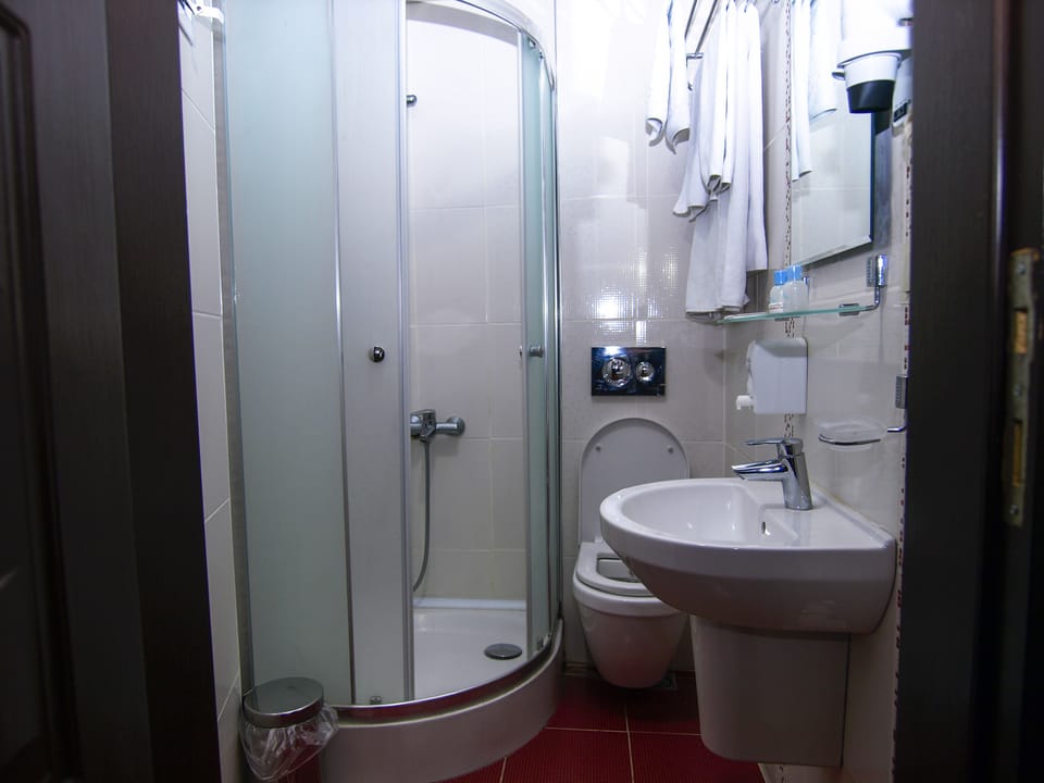 Shower, free toiletries, hair dryer, slippers