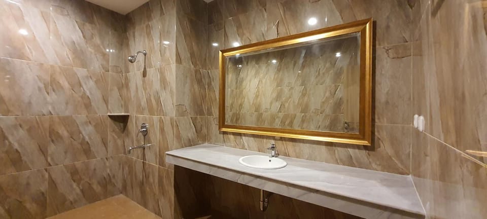 Shower, slippers, bidet, towels