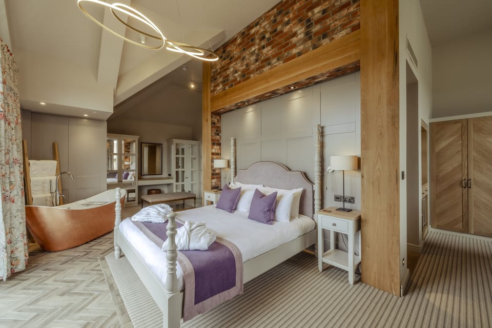 Junior Suite, Patio, Lake View | Iron/ironing board, WiFi (free), bed sheets
