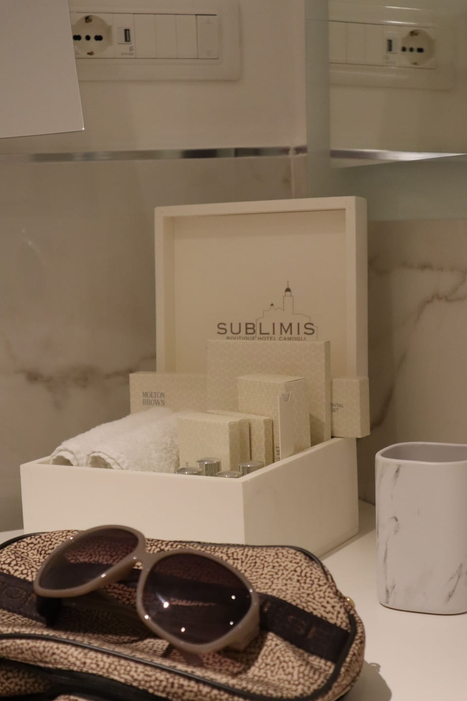 Designer toiletries, hair dryer, bathrobes, slippers