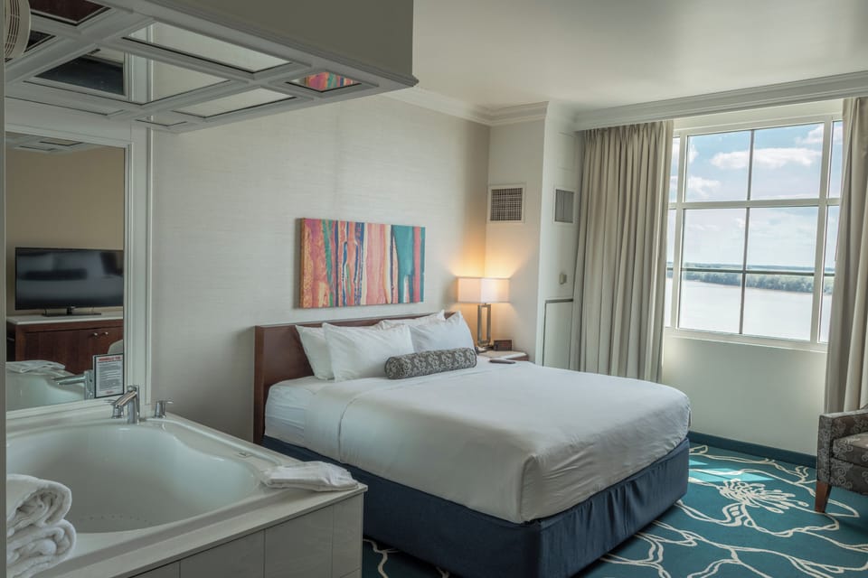 Suite, 1 King Bed, Smoking | 1 bedroom, hypo-allergenic bedding available, in-room safe, desk