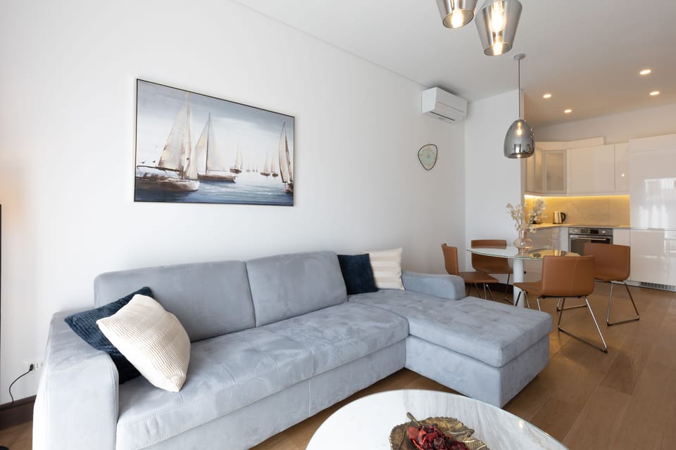 Deluxe Apartment | Living area | 55-inch flat-screen TV with cable channels, TV, fireplace