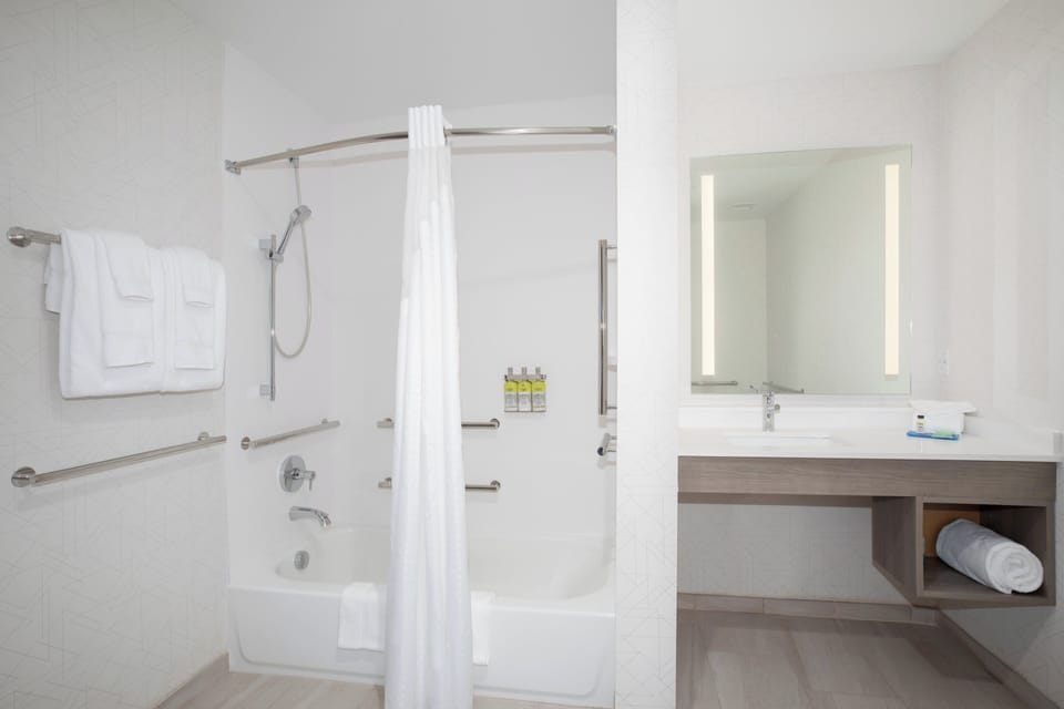 Combined shower/tub, hair dryer, towels, soap