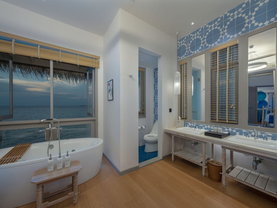 Separate tub and shower, rainfall showerhead, eco-friendly toiletries