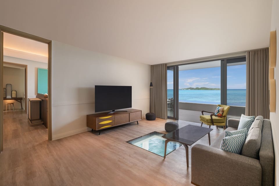 Villa, 2 Bedrooms, Ocean View (Overwater) | Living room | 55-inch LED TV with cable channels, TV, toys