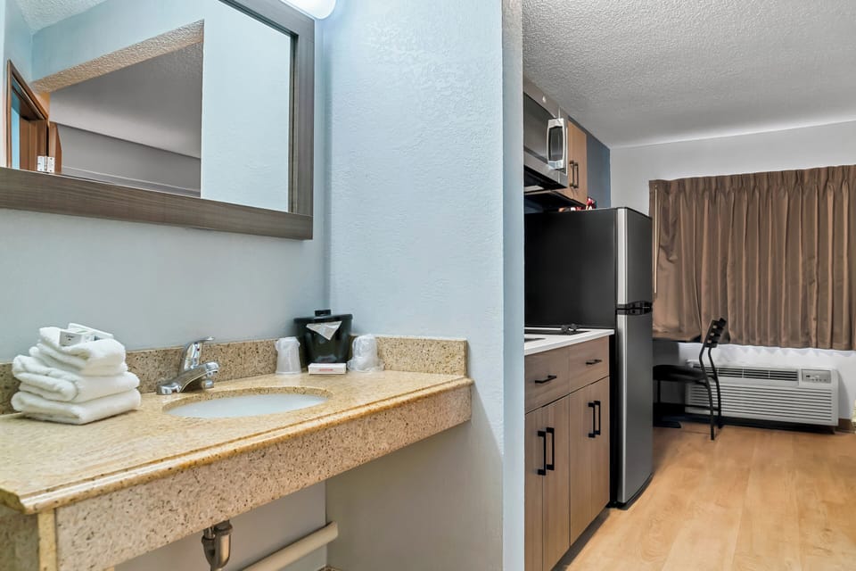 Studio, 1 King Bed, Accessible, Non Smoking (Roll-In Shower) | Bathroom | Towels, soap, shampoo, toilet paper