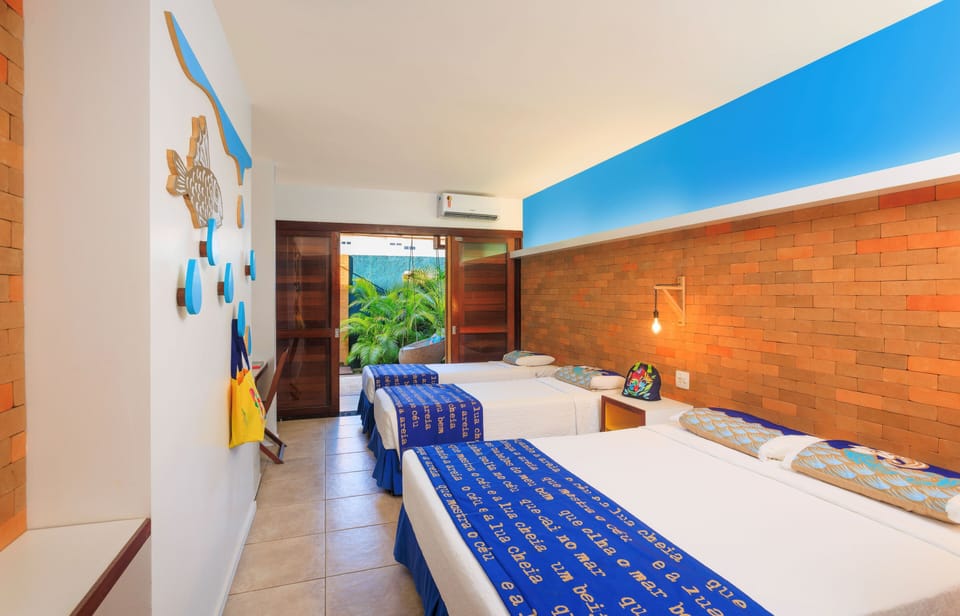Apartamento Quintal Familia | Minibar, in-room safe, individually furnished, desk
