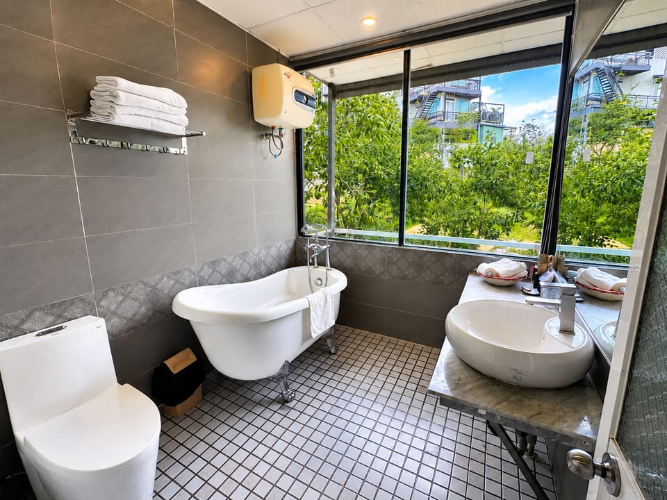 Signature Family Suite (Rose) | Bathroom | Rainfall showerhead, free toiletries, hair dryer, slippers