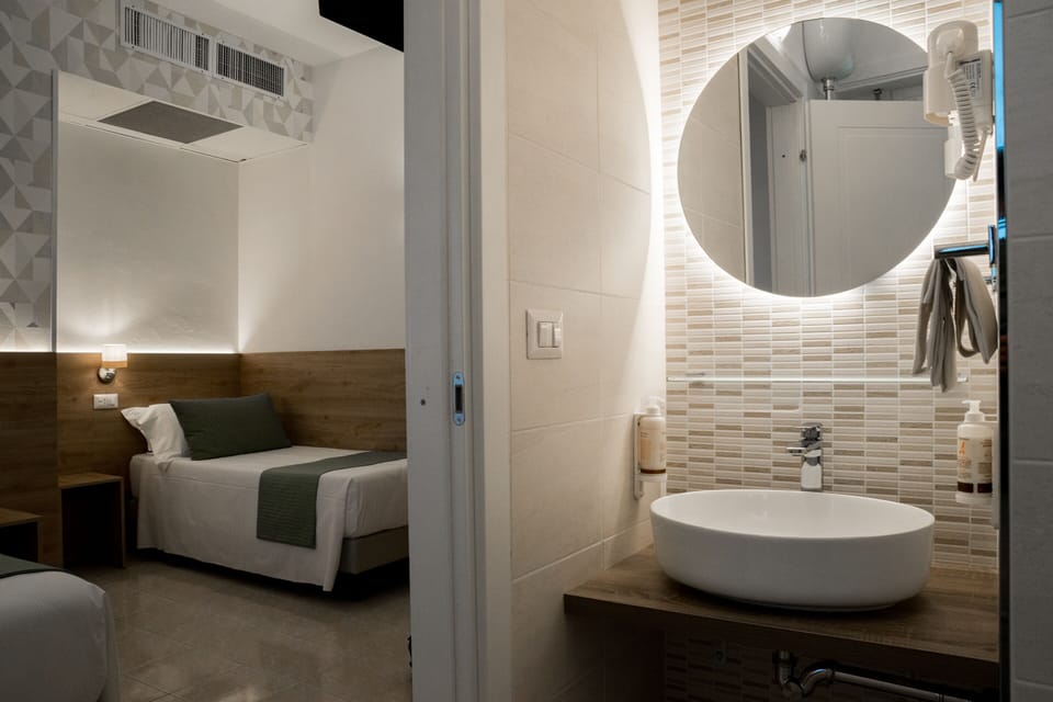 Superior Triple Room | Bathroom | Shower, rainfall showerhead, free toiletries, hair dryer