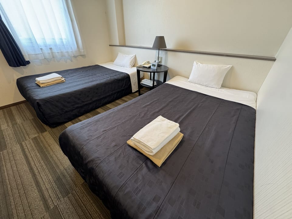 Desk, laptop workspace, WiFi (free), bed sheets