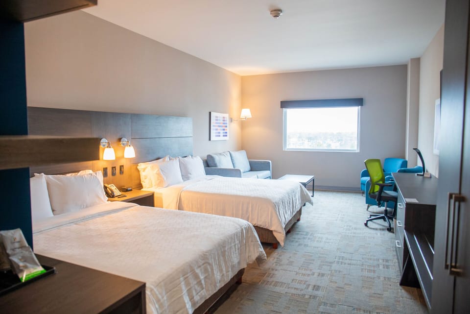 Suite, 2 Queen Beds | In-room safe, desk, blackout drapes, iron/ironing board