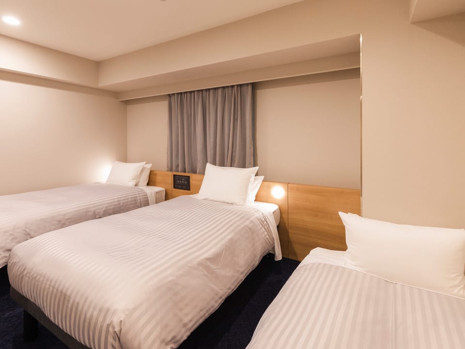 Triple Room, Non Smoking | Down comforters, desk, blackout drapes, iron/ironing board