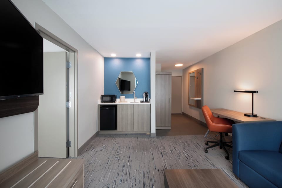 In-room safe, desk, iron/ironing board, cribs (free)