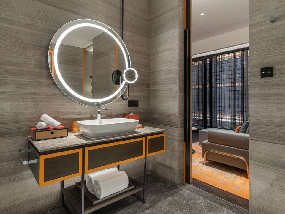 Separate tub and shower, rainfall showerhead, designer toiletries