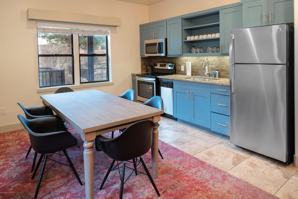 Suite, 1 King Bed, Garden View | Private kitchen | Fridge, microwave, coffee/tea maker, freezer