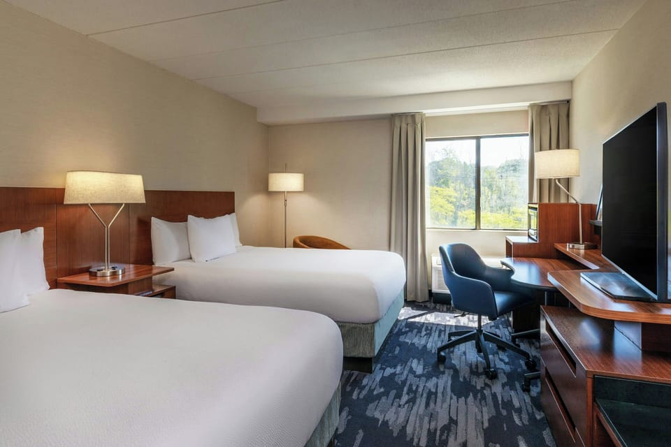 Desk, laptop workspace, iron/ironing board, travel crib