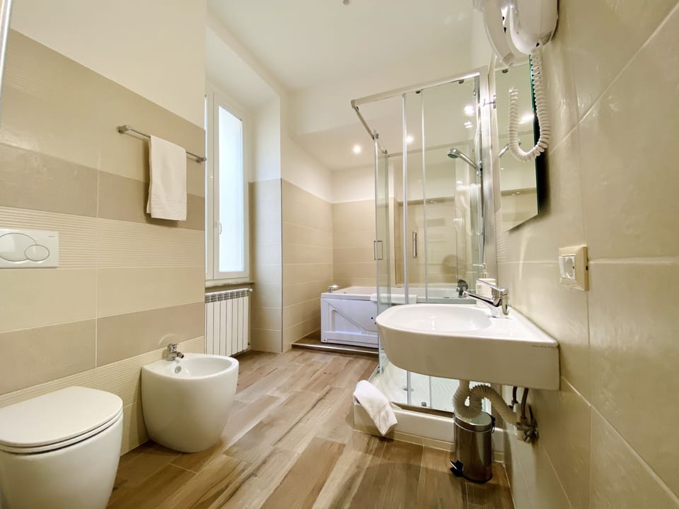 Exclusive Studio Suite | Bathroom | Hair dryer, bidet, towels, soap