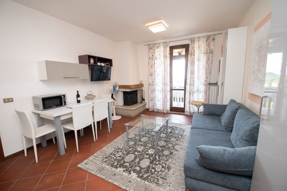 Family Apartment | Living area | 50-inch TV with cable channels