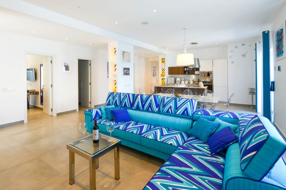 Luxury Villa | Living room | 50-inch flat-screen TV with satellite channels, TV, fireplace