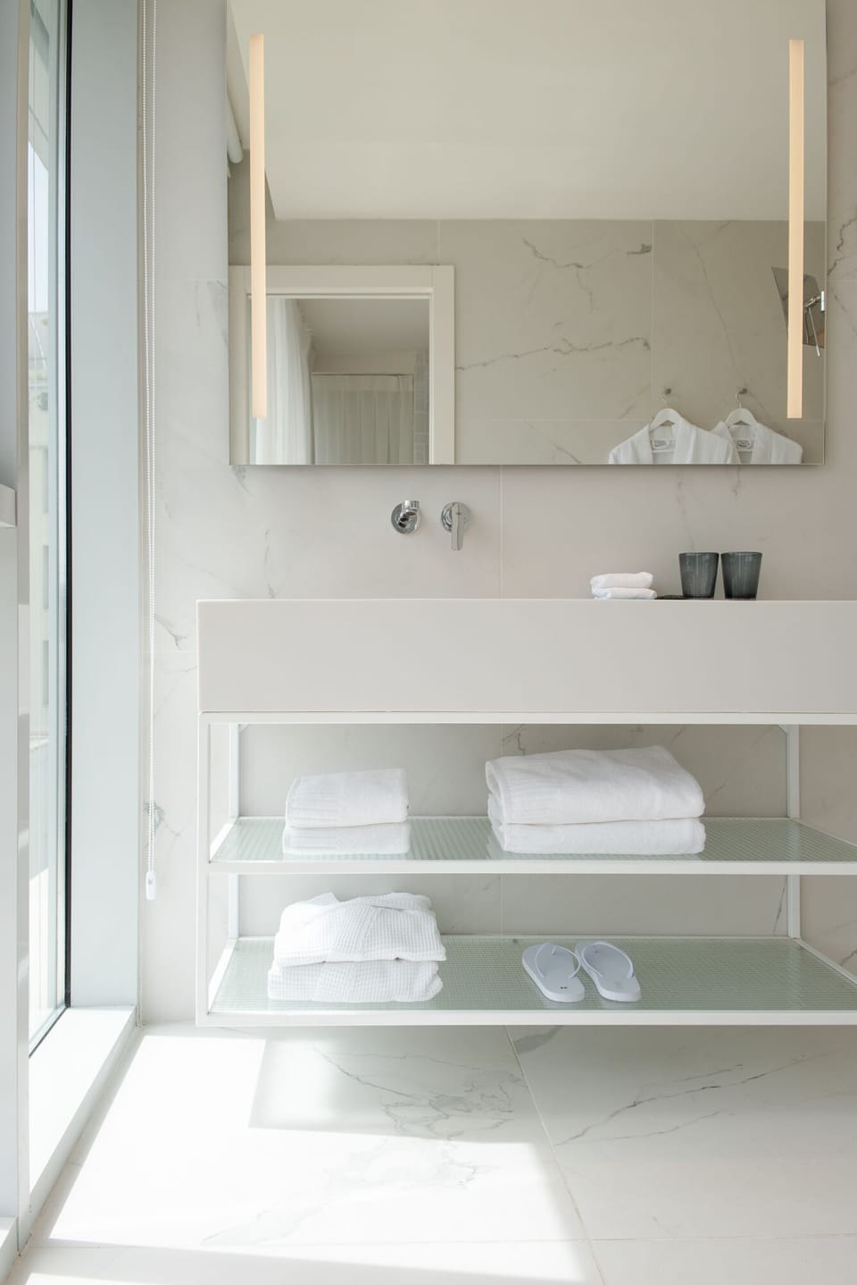 Designer toiletries, hair dryer, bathrobes, slippers