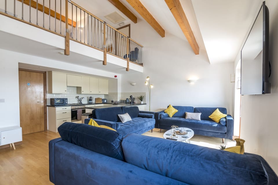 Apartment (3 Bedrooms) | Living area | 55-inch Smart TV with cable channels, TV