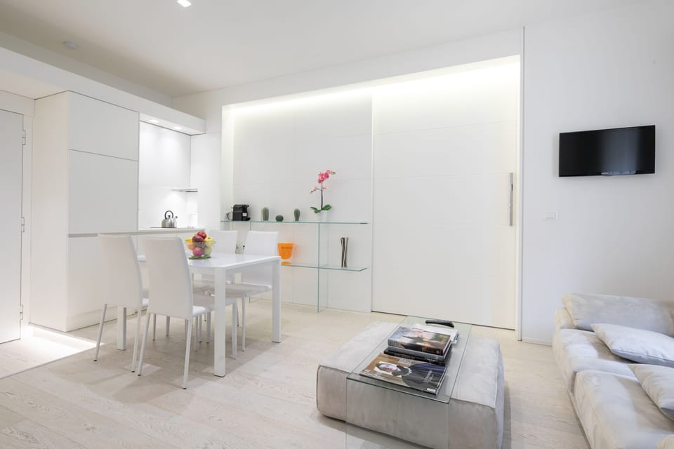 Deluxe Apartment | Living area | Flat-screen TV
