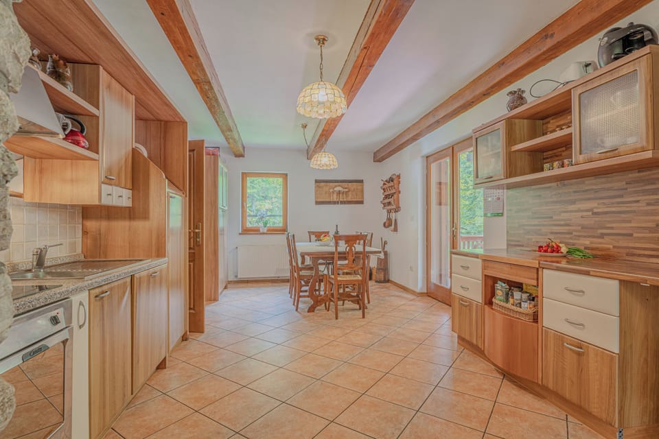 Family Chalet, 4 Bedrooms, 2 Bathrooms, Mountainside (Chalet Primus Near Soča Gorge) | Private kitchen | Stovetop, coffee/tea maker, electric kettle, dining tables