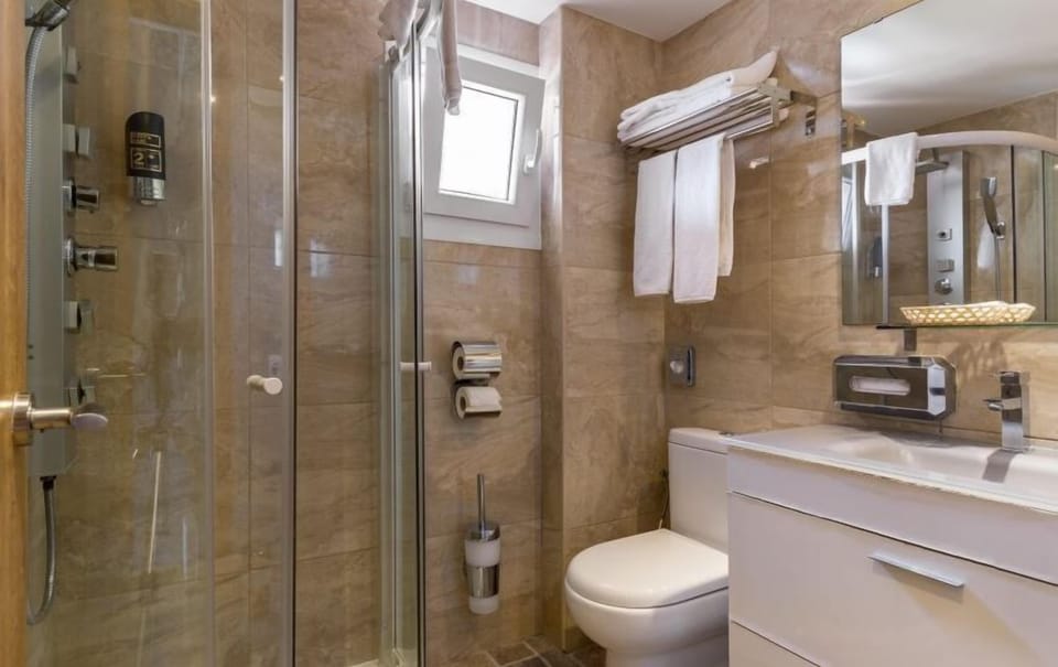 Family Room, Balcony | Bathroom | Shower, hair dryer, towels, soap