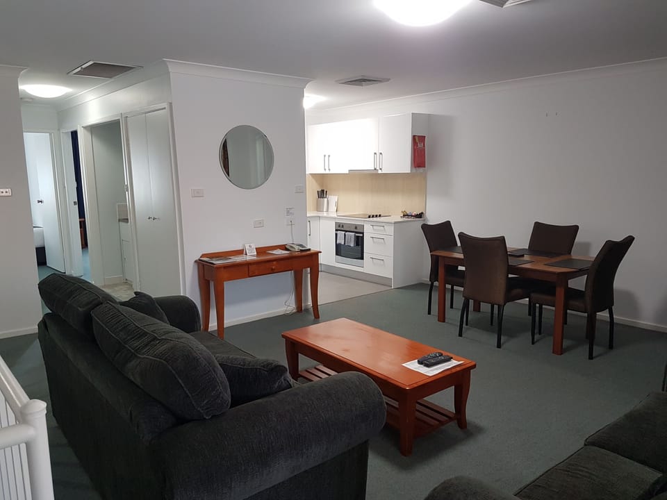 Two Bedroom Apartment | Living area | 40-inch flat-screen TV with digital channels, TV, Netflix