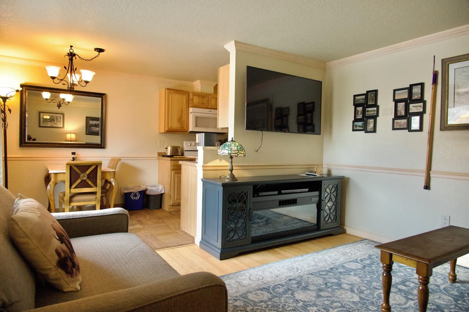 Suite | Living area | 65-inch Smart TV with satellite channels, TV, DVD player