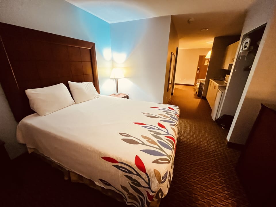Queen Kitchenette Suite | Desk, blackout drapes, iron/ironing board, free WiFi