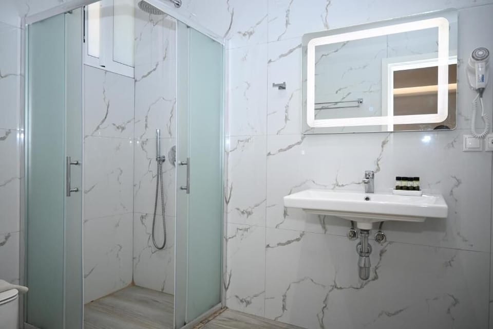 Double Room, Ground Floor | Bathroom | Shower, hair dryer, towels, soap