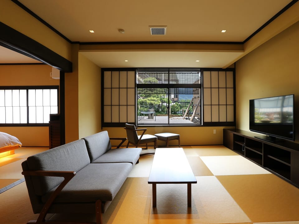Deluxe Suite, Terrace, Garden View | Down comforters, in-room safe, WiFi (free), bed sheets