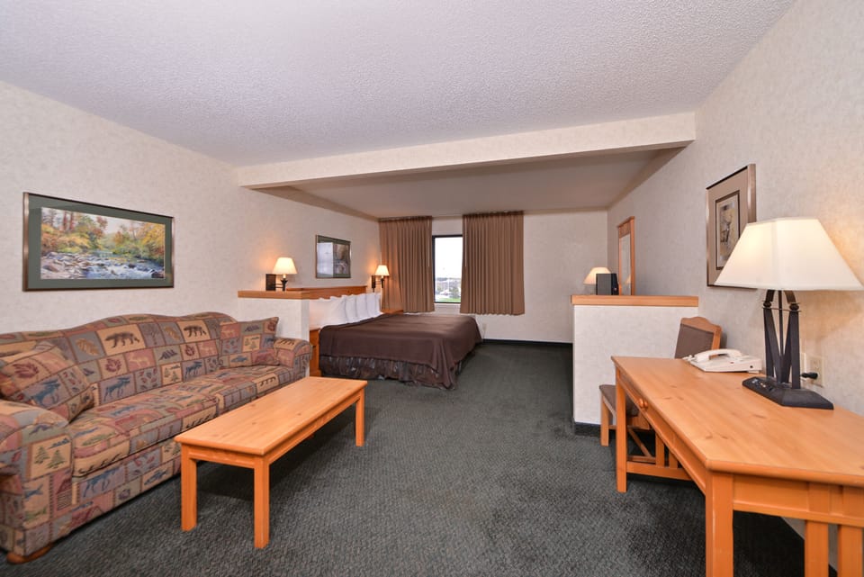 Suite, 1 King Bed with Sofa bed, Jetted Tub (King Suites Main Floor - Jetted Tub) | In-room safe, iron/ironing board, free WiFi, bed sheets