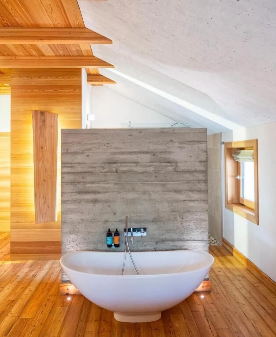 Designer toiletries, hair dryer, slippers, towels
