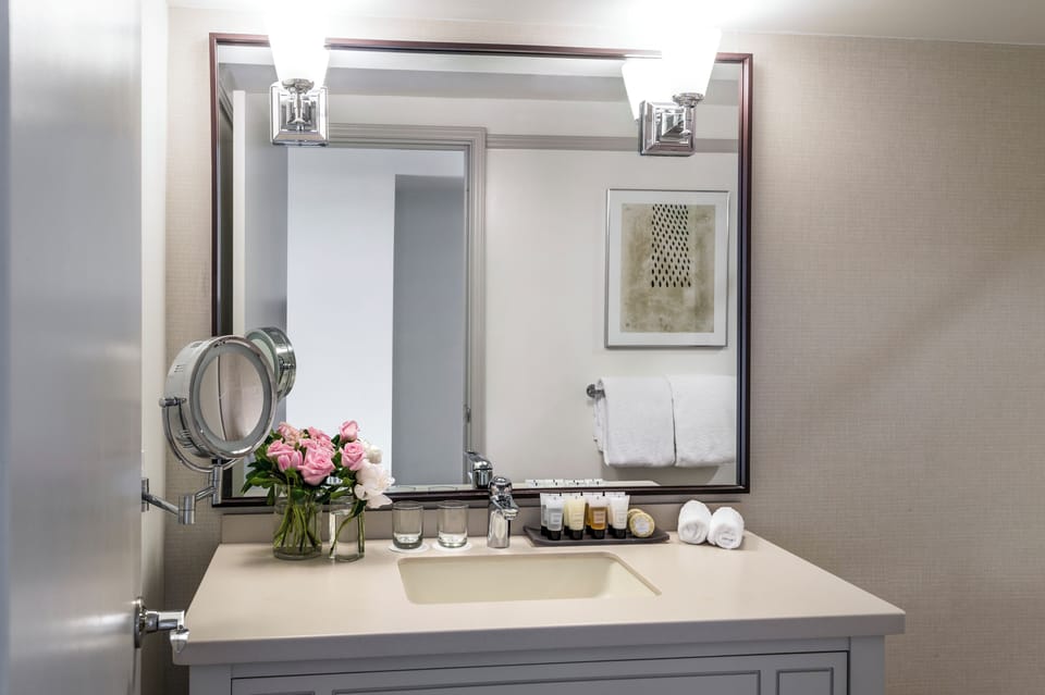 Combined shower/tub, designer toiletries, hair dryer, bathrobes