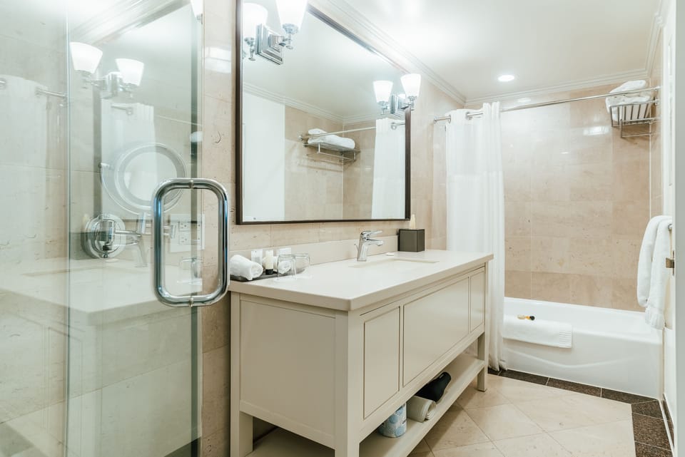 Combined shower/tub, designer toiletries, hair dryer, bathrobes