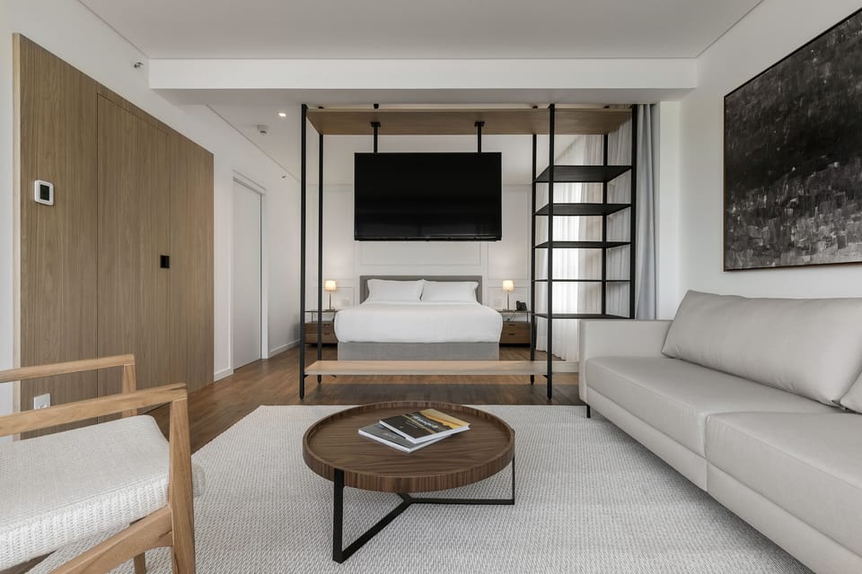 Deluxe Suite, 1 King Bed, Sea View | Living area | 50-inch Smart TV with cable channels, TV
