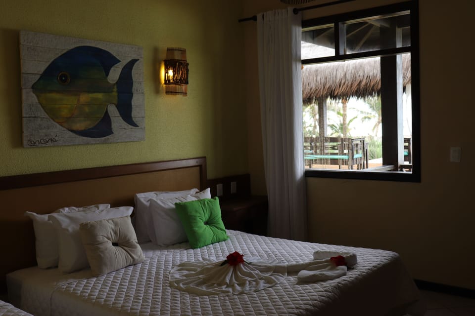 Deluxe Double Room, Sea View | Minibar, individually decorated, individually furnished, desk