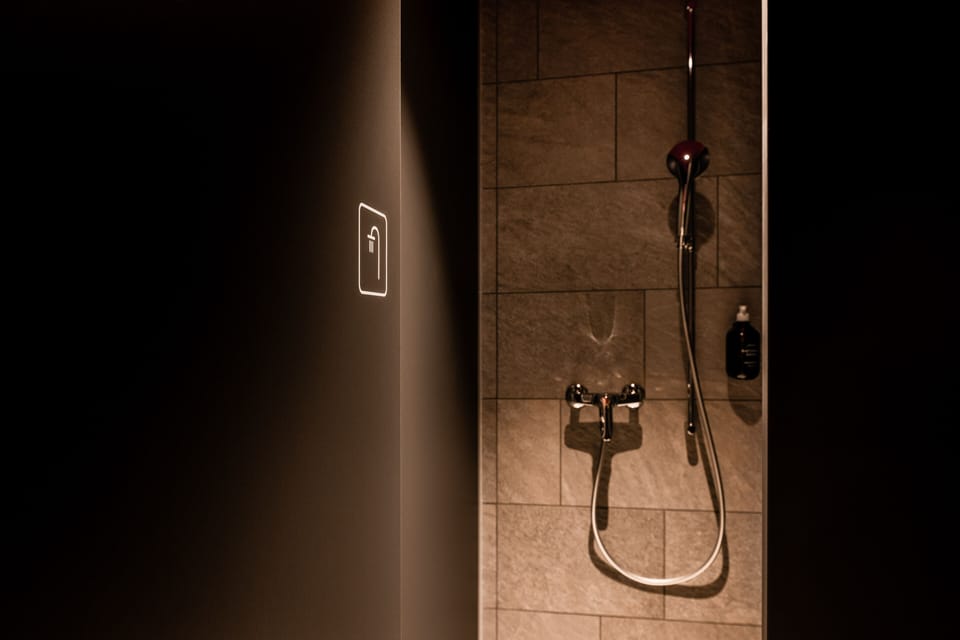 Female Only - Swiss Capsule (upper level) | Bathroom | Shower, hair dryer, towels