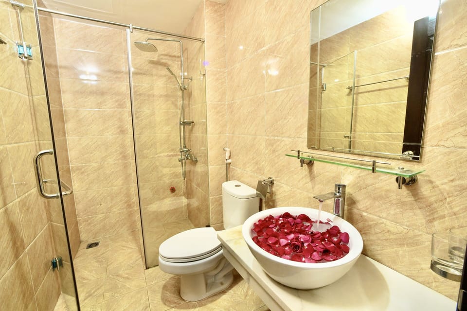 Bathtub, designer toiletries, hair dryer, soap