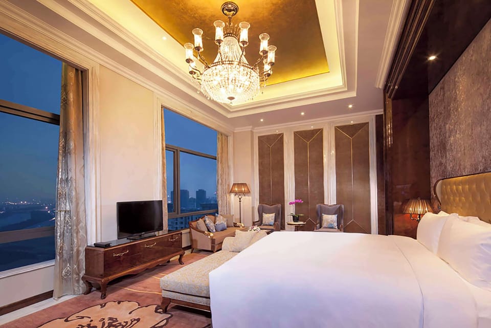Presidential Suite, 1 King Bed | Living area | 42-inch LED TV with cable channels, TV