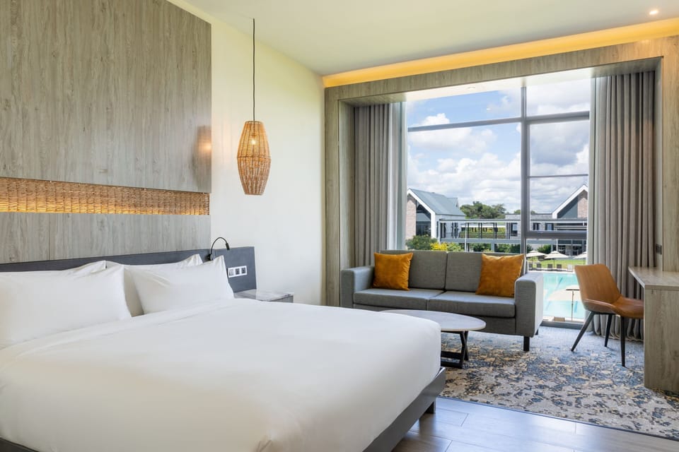 Deluxe Room, 1 King Bed | Pool | Outdoor pool, pool umbrellas, sun loungers